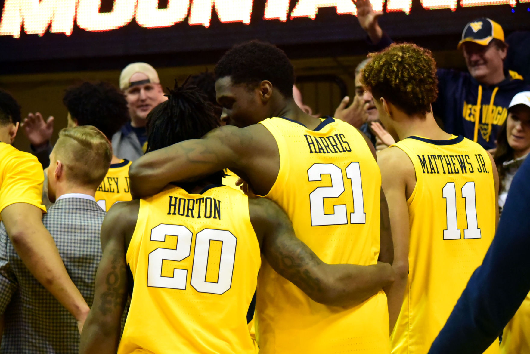 WVU’s Horton, Harris, and Mattews Jr. celebrate the mountaineer victory over the Oklahoma Sooners.